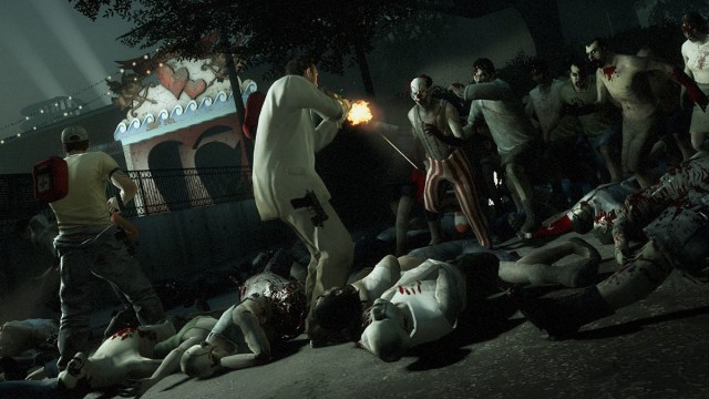 Left 4 Dead 2: Nick and Ellis fighting off a horde of zombies at a carnival.