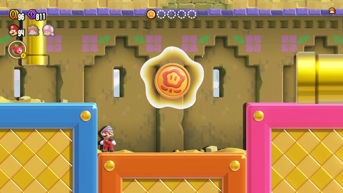 Mario in front of a Wonder Coin