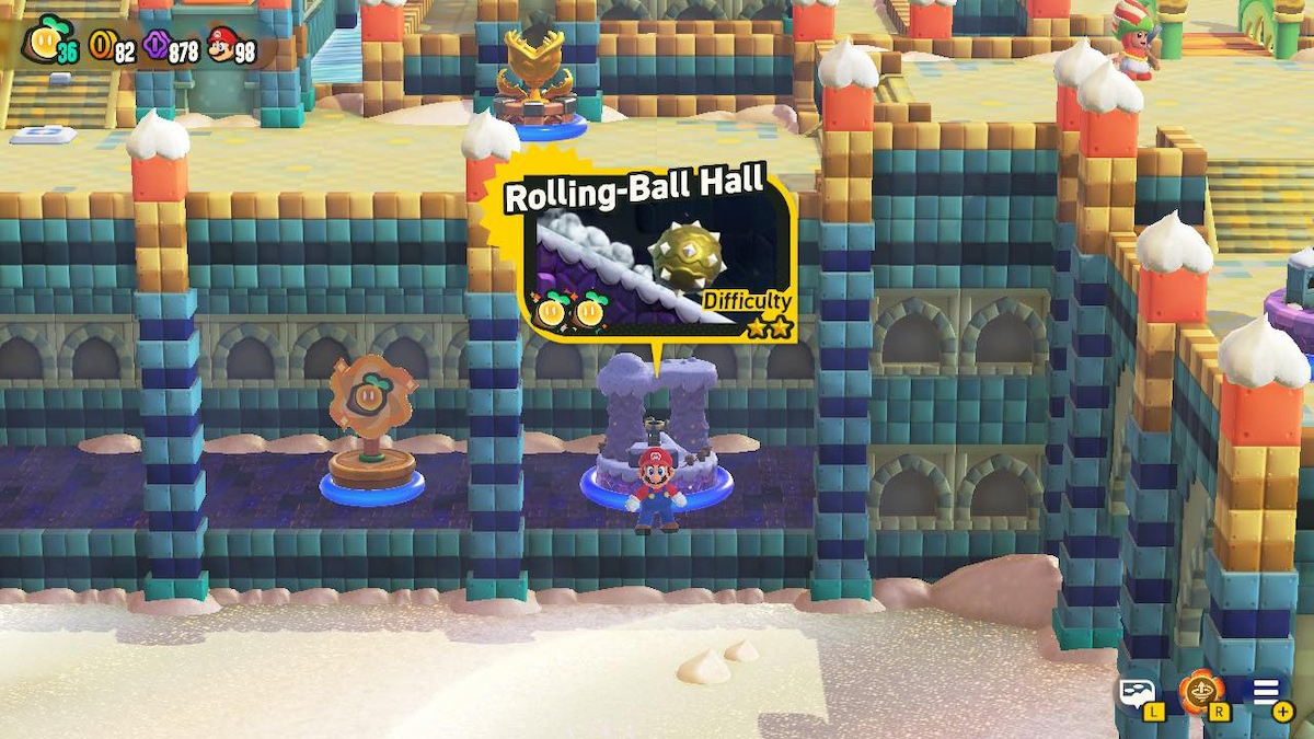 Mario standing by Rolling-Ball Hall level entry in Sunbaked Desert