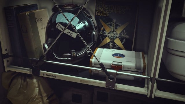 Starfield: a close-up of a locker showing some books and a space helmet.