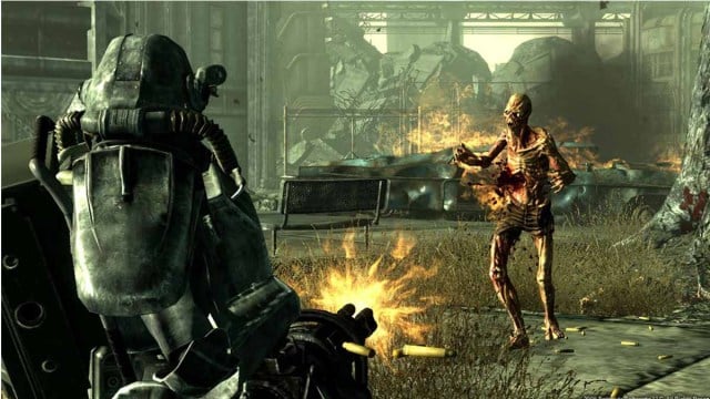 A Power Armor shooting a minigun at a Ghoul