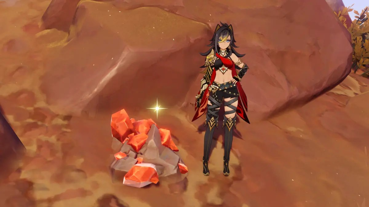 Dehya from Genshin Impact stands next to a Trishiraite crystal.