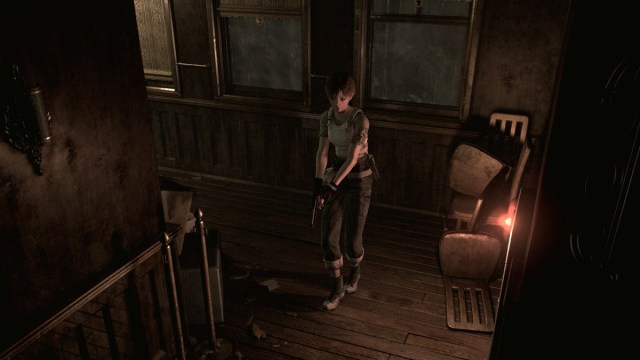 Resident Evil Zero: Rebecca Chambers walks down a dimly lit corridor.