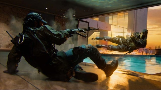 A CoD player sliding and firing their weapon, while an enemy jumps to the side.