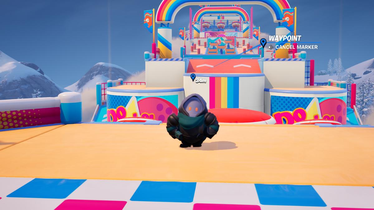 A Fortnite character disguised as a Fall Guys Bean standing on an obstacle course