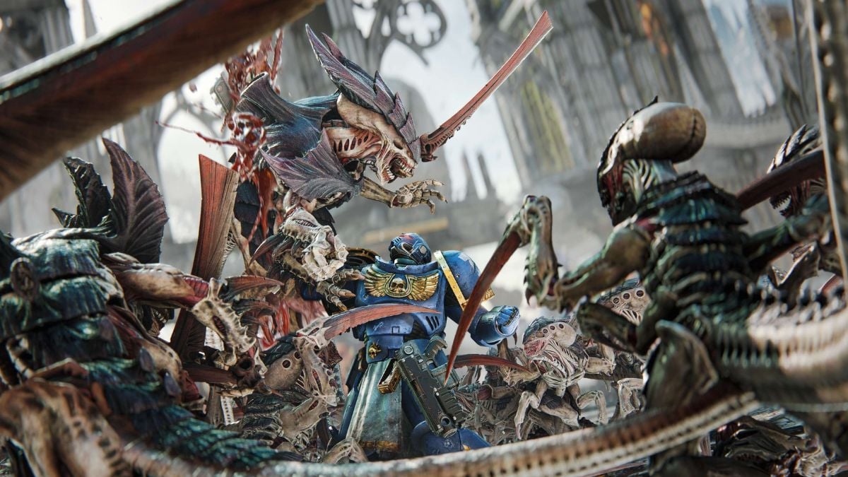 ultramarine killing tyranid in warhammer 40k space marine 2