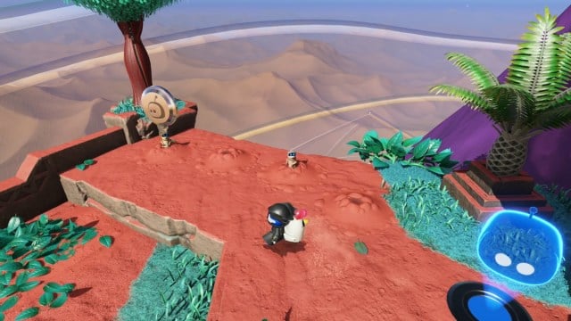 Astro Bot looking at two prairie dogs where a bot is hidden.