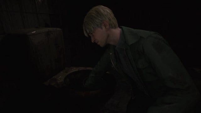 Silent Hill 2 Remake James reaches his hands into a disgusting toilet.