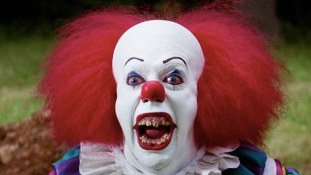 Tim Curry as Pennywise in the IT movie adaptation