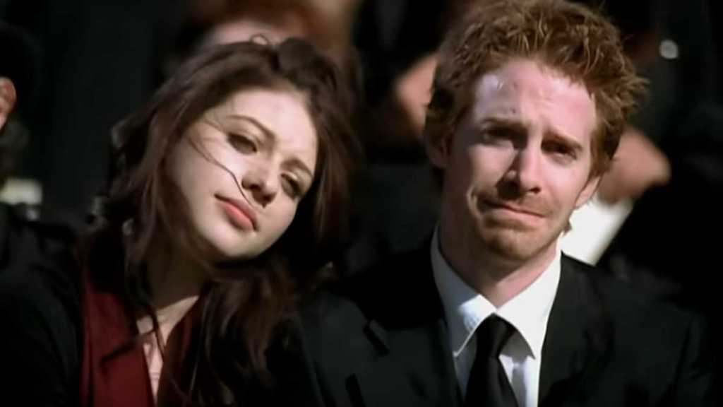 Michelle Trachtenberg and Seth Green in the music video for "This Ain't a Scene, It's an Arms Race" by Fall Out Boy