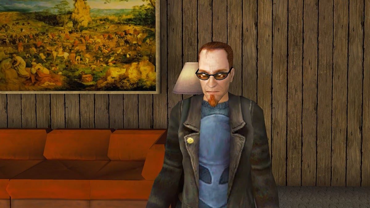 Postal 2: The Postal Dude standing in a room with a red sofa behind him.